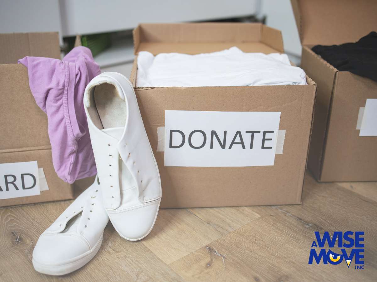 Boxes labeled for donation and discard, illustrating decluttering your home before a move