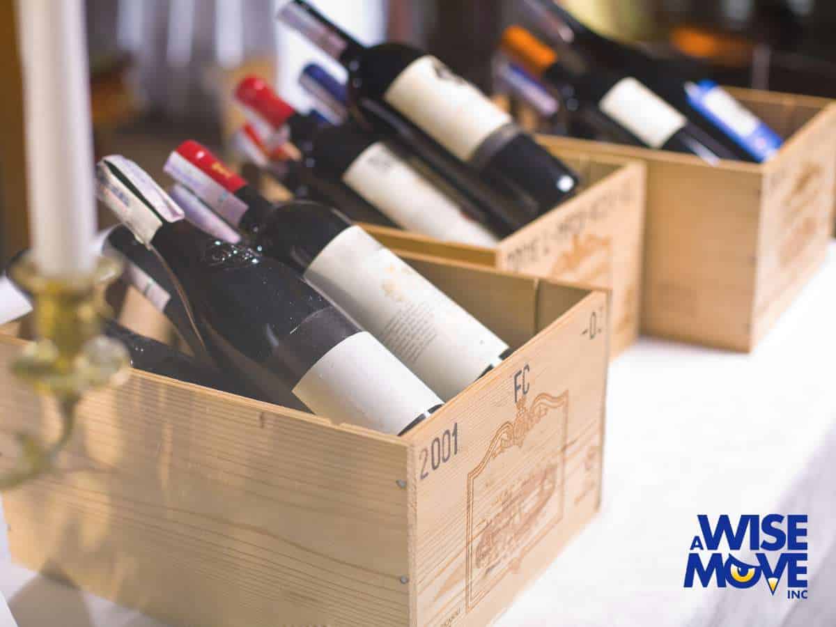 Wooden crates filled with wine bottles, illustrating how to Move a Wine Collection Safely with expert care
